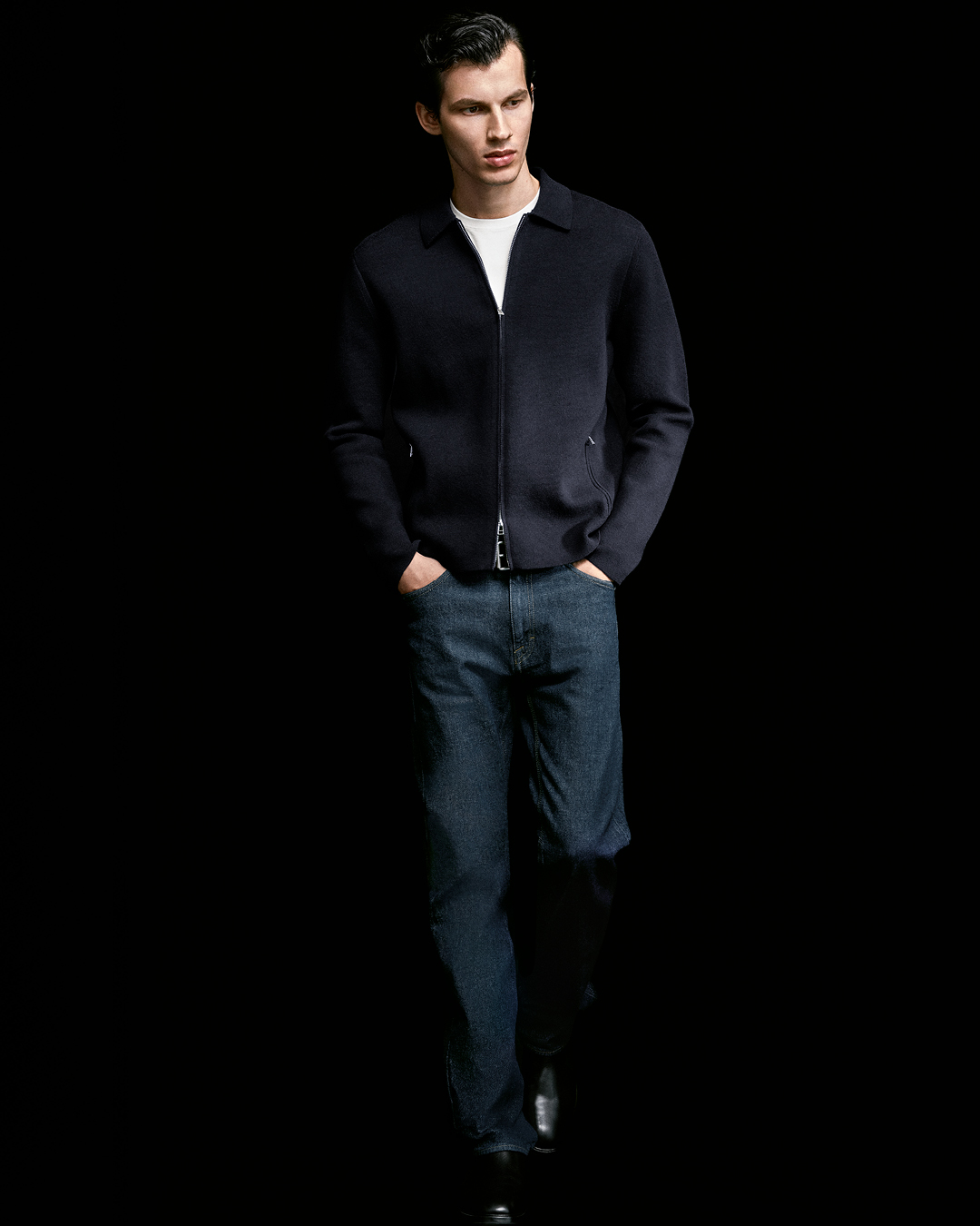 man in denim and cardigan